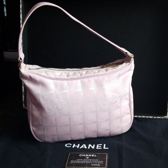 CHANEL Handbags - Authentic Chanel  baby pink travel line bag